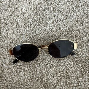 Gold and Black Oval Sunglasses